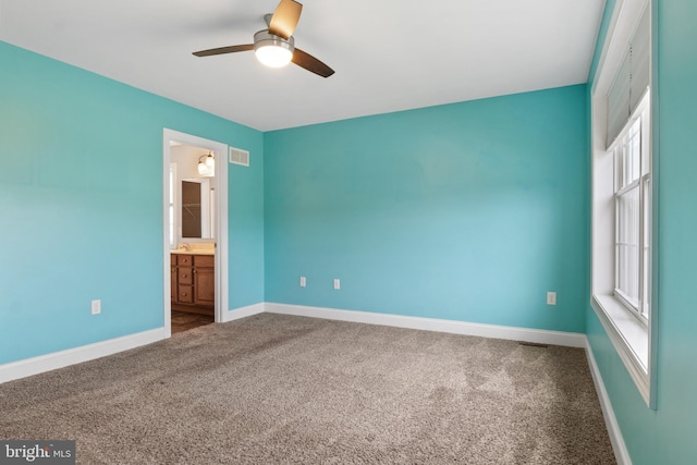 355 Old Stone Way, York, PA 17406 - unfurnished bedroom with carpet floors, multiple windows, ensuite bath, and a ceiling fan