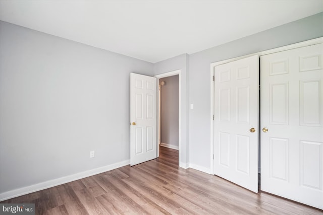 7985 Riggs Rd Unit 5, Hyattsville, MD 20783 - unfurnished bedroom featuring light wood-style flooring and a closet
