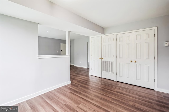 7985 Riggs Rd Unit 5, Hyattsville, MD 20783 - unfurnished bedroom with wood finished floors and a closet