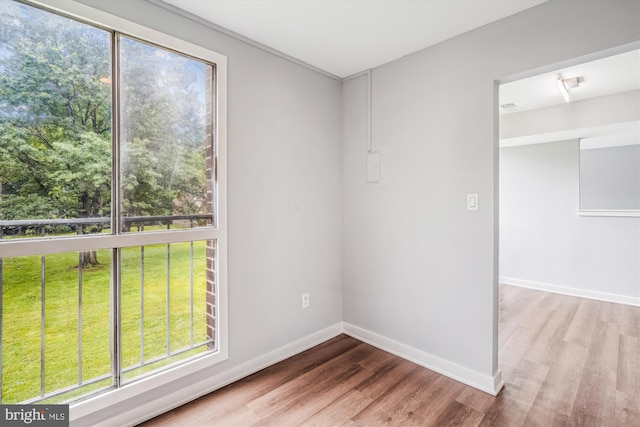 7985 Riggs Rd Unit 5, Hyattsville, MD 20783 - spare room featuring wood finished floors and plenty of natural light