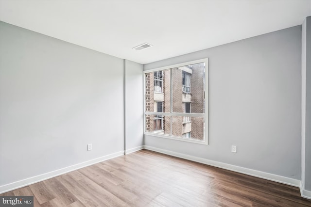 7985 Riggs Rd Unit 5, Hyattsville, MD 20783 - empty room featuring wood finished floors and baseboards