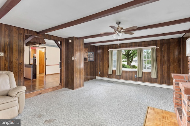 150 Coolidge Ave, Lawrence Township, NJ 08648 - unfurnished living room featuring wood walls, a baseboard heating unit, beam ceiling, a ceiling fan, and carpet floors