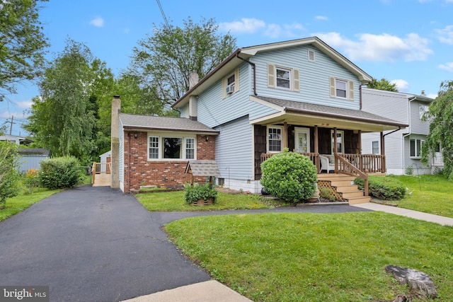 150 Coolidge Ave, Lawrence Township, NJ 08648 - view of front of house with a porch, a chimney, a front lawn, and brick siding