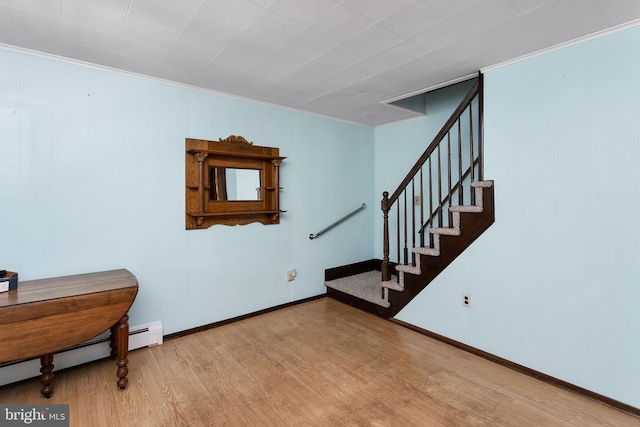 150 Coolidge Ave, Lawrence Township, NJ 08648 - staircase featuring wood finished floors, a baseboard heating unit, and ornamental molding