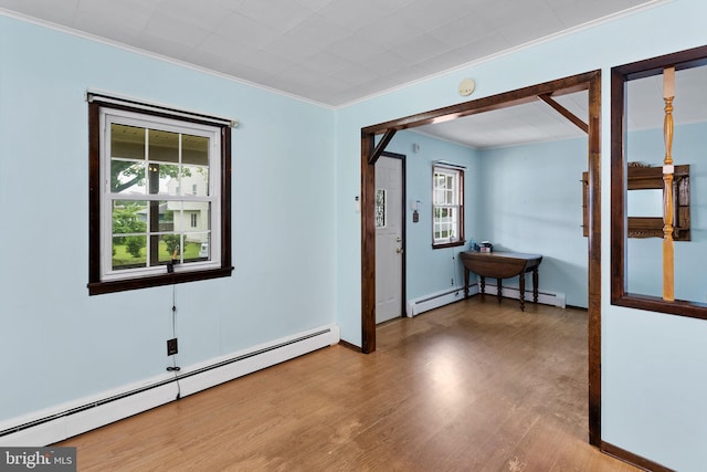 150 Coolidge Ave, Lawrence Township, NJ 08648 - unfurnished room with a baseboard radiator, ornamental molding, and wood finished floors