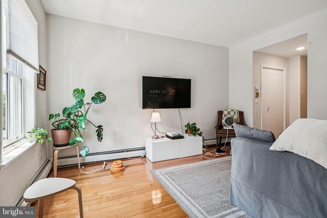 1917 Spring Garden St, Philadelphia, PA 19130 - living room with wood finished floors and a baseboard radiator