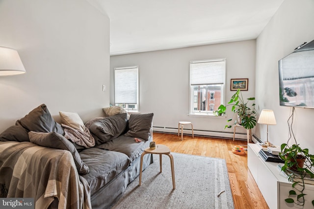 1917 Spring Garden St, Philadelphia, PA 19130 - living room with a baseboard radiator, plenty of natural light, and wood finished floors