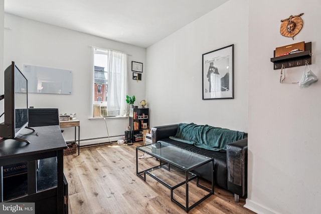 1917 Spring Garden St, Philadelphia, PA 19130 - living room with wood finished floors, baseboard heating, and a desk