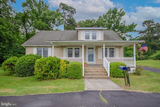 24981 Delmar Rd, Mardela Springs, MD 21837 - bungalow-style house featuring a chimney, a front lawn, a porch, and roof with shingles