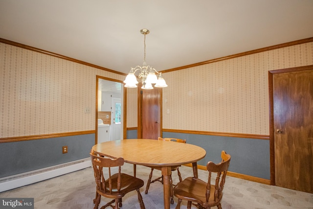 24981 Delmar Rd, Mardela Springs, MD 21837 - dining room featuring a baseboard heating unit, separate washer and dryer, ornamental molding, a chandelier, and a wainscoted wall
