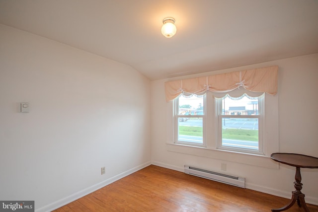 24981 Delmar Rd, Mardela Springs, MD 21837 - unfurnished dining area with baseboard heating, light wood finished floors, and vaulted ceiling