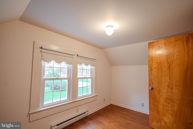 24981 Delmar Rd, Mardela Springs, MD 21837 - bonus room featuring a baseboard radiator, vaulted ceiling, and wood finished floors