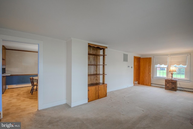 24981 Delmar Rd, Mardela Springs, MD 21837 - carpeted spare room featuring ornamental molding, baseboard heating, and a baseboard radiator