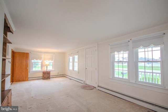 24981 Delmar Rd, Mardela Springs, MD 21837 - spare room with baseboard heating, carpet flooring, and ornamental molding
