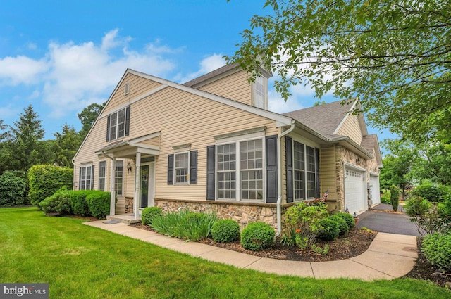 3132 Arbour Green Ct, Hatfield, PA 19440 - view of front facade with an attached garage, a front yard, stone siding, driveway, and roof with shingles