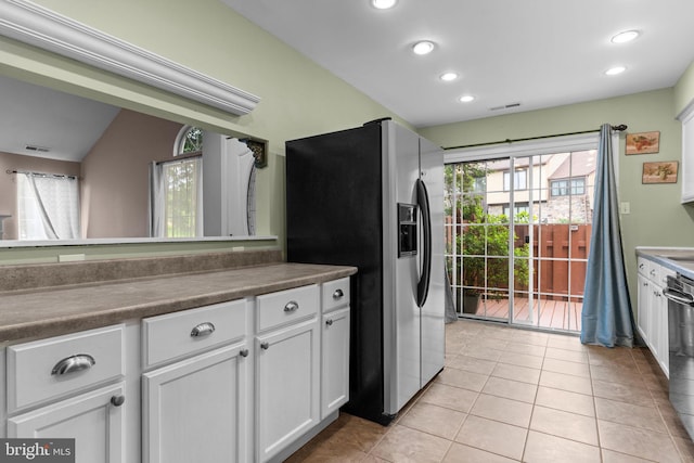 2109 Sturbridge Cmn, Holland, PA 18966 - kitchen featuring stainless steel fridge with ice dispenser, white cabinetry, recessed lighting, dark countertops, and light tile patterned floors