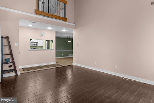 2109 Sturbridge Cmn, Holland, PA 18966 - unfurnished living room featuring wood finished floors, a high ceiling, and recessed lighting