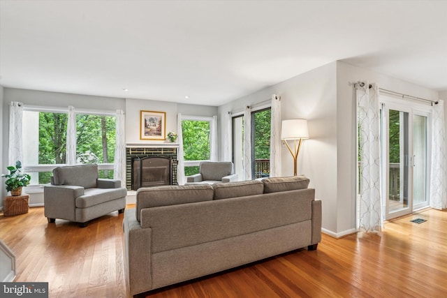 705 Westtown Cir Unit 705, West Chester, PA 19382 - living room featuring a glass covered fireplace, wood finished floors, and recessed lighting
