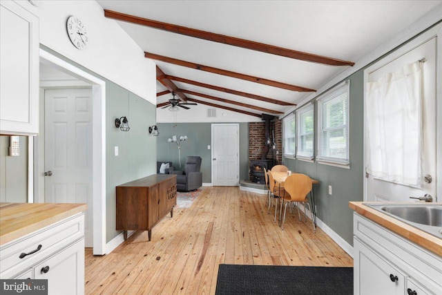 132 Erie Trl, Winchester, VA 22602 - interior space with a wood stove, light wood-style floors, and ceiling fan
