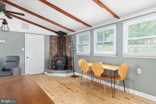 132 Erie Trl, Winchester, VA 22602 - dining room featuring wood-type flooring, a wood stove, and ceiling fan