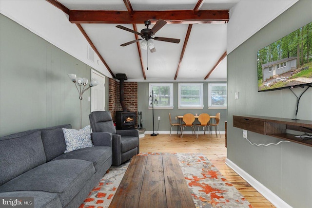 132 Erie Trl, Winchester, VA 22602 - living area with a wood stove, wood finished floors, and a ceiling fan