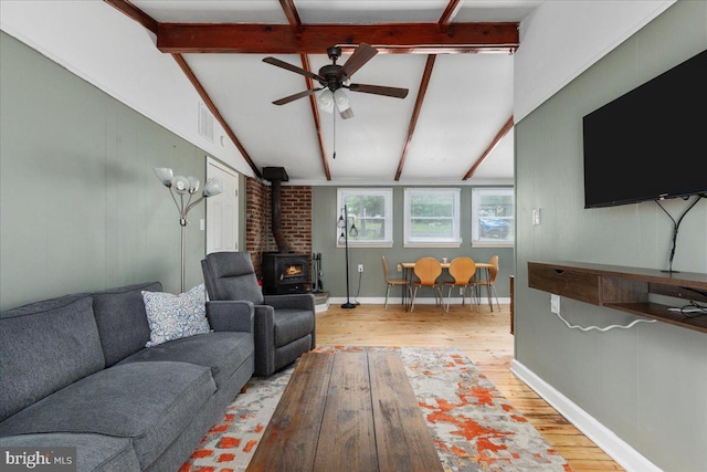 132 Erie Trl, Winchester, VA 22602 - living area featuring a wood stove, wood finished floors, and ceiling fan