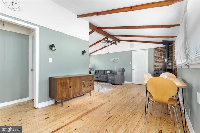 132 Erie Trl, Winchester, VA 22602 - living area featuring a wood stove, hardwood / wood-style flooring, and a ceiling fan