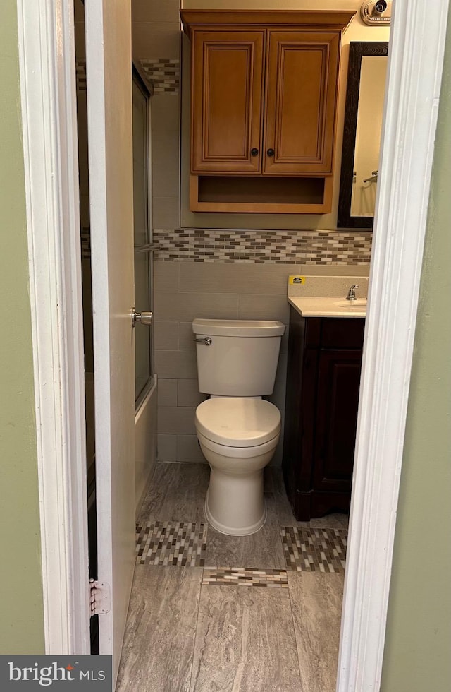 140 Joyceton Ter, Upper Marlboro, MD 20774 - full bath with vanity, combined bath / shower with glass door, and tile walls