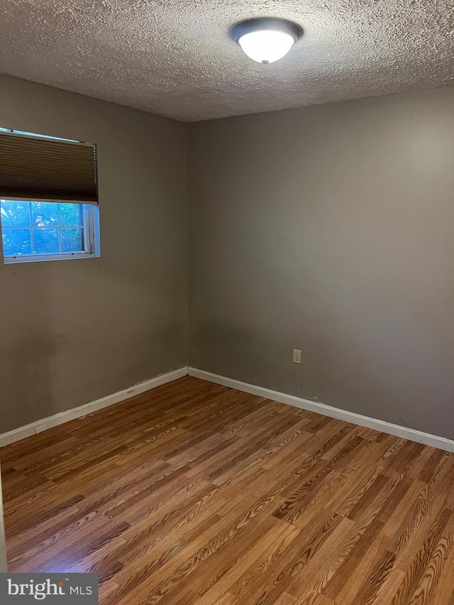 140 Joyceton Ter, Upper Marlboro, MD 20774 - empty room with wood finished floors and a textured ceiling