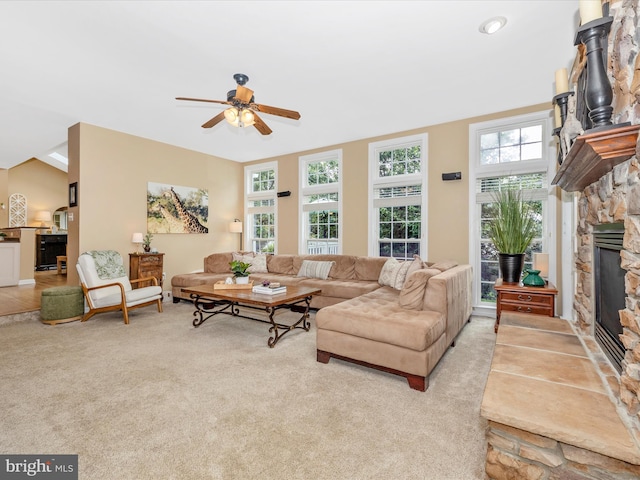 9045 Clendenin Way, Frederick, MD 21704 - living room with a ceiling fan, a stone fireplace, and light carpet