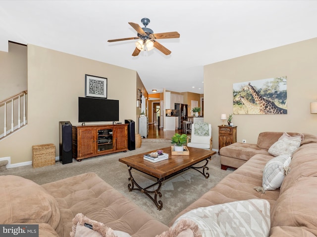 9045 Clendenin Way, Frederick, MD 21704 - living room featuring ceiling fan, light carpet, and stairs