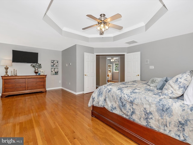 9045 Clendenin Way, Frederick, MD 21704 - bedroom featuring a raised ceiling, wood finished floors, ornamental molding, and a ceiling fan