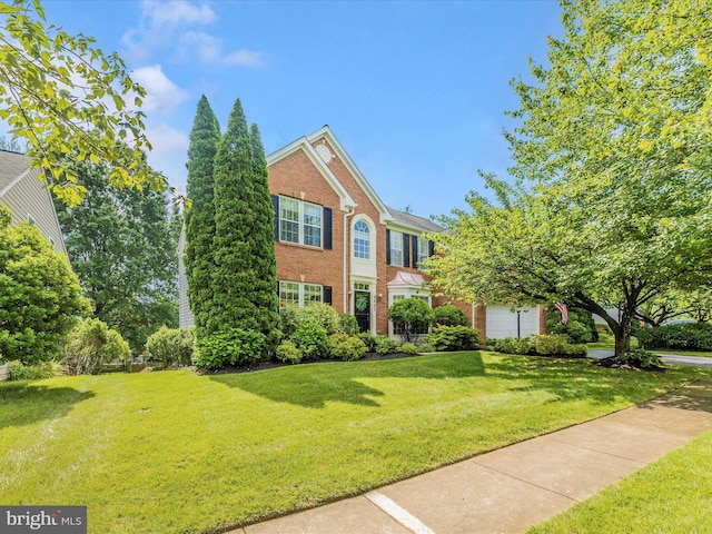 9045 Clendenin Way, Frederick, MD 21704 - view of front facade featuring brick siding and a front lawn