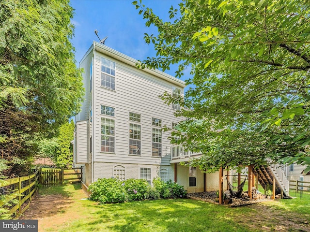 9045 Clendenin Way, Frederick, MD 21704 - back of property featuring a fenced backyard, stairway, and brick siding