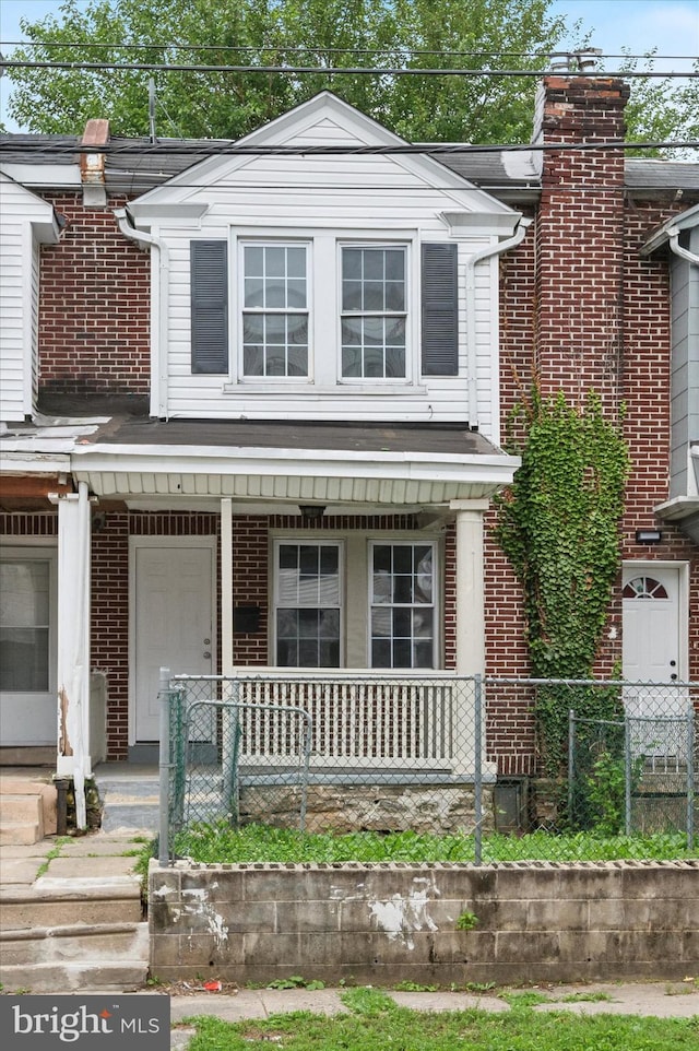 5852 Crittenden St, Philadelphia, PA 19138 - view of front facade with a porch and brick siding