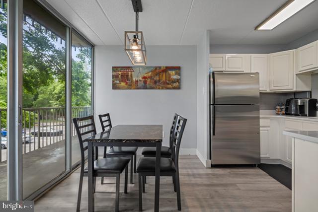 401 Cooper Landing Rd Unit 225, Cherry Hill, NJ 08002 - dining room with a wall of windows and light wood finished floors