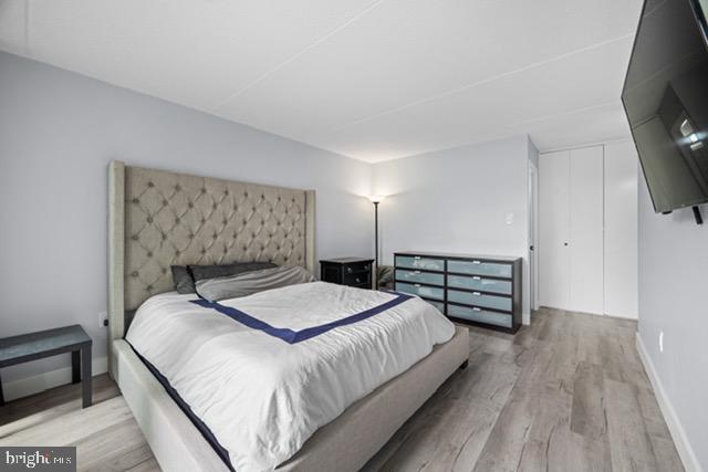 401 Cooper Landing Rd Unit 225, Cherry Hill, NJ 08002 - bedroom featuring wood finished floors and a closet