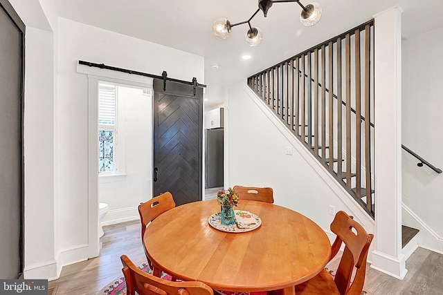 528 N St, Lancaster, PA 17602 - dining area featuring wood finished floors, a barn door, and stairway