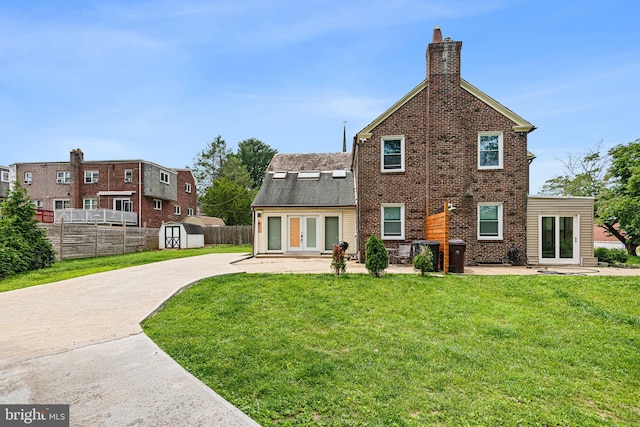 4102 N W St, Wilmington, DE 19802 - back of house with french doors, a patio, a shed, and a chimney