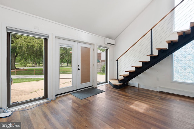 4102 N W St, Wilmington, DE 19802 - foyer with an AC wall unit, stairs, wood finished floors, and vaulted ceiling