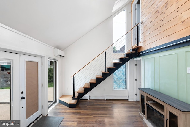 4102 N W St, Wilmington, DE 19802 - entrance foyer featuring stairs, a baseboard radiator, wood finished floors, and high vaulted ceiling