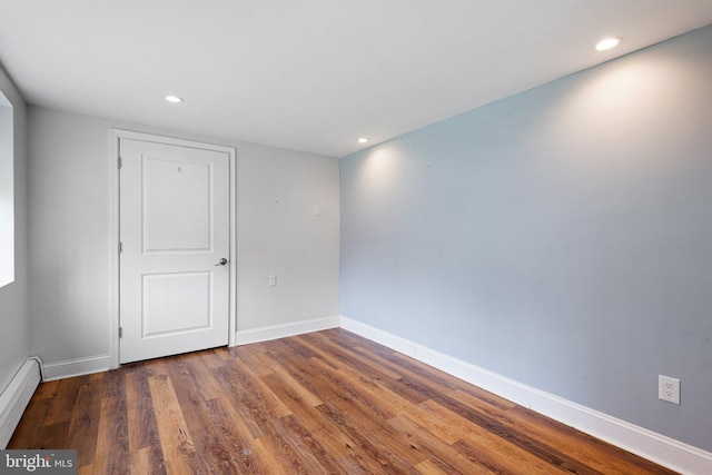 4102 N W St, Wilmington, DE 19802 - spare room with a baseboard radiator, wood finished floors, and recessed lighting