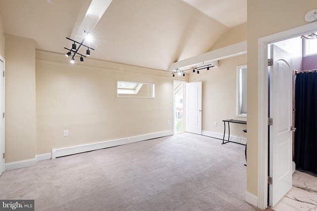 4102 N W St, Wilmington, DE 19802 - unfurnished living room featuring a baseboard heating unit, lofted ceiling, and carpet floors