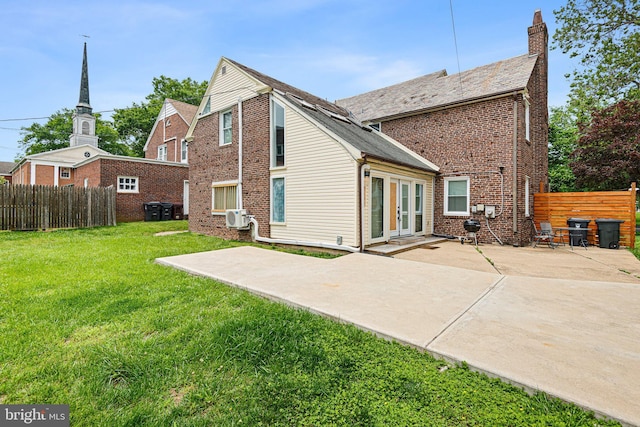 4102 N W St, Wilmington, DE 19802 - rear view of house with a patio area, brick siding, and a chimney