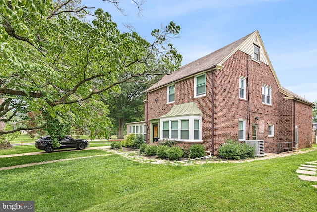 4102 N W St, Wilmington, DE 19802 - view of home's exterior with brick siding and a lawn