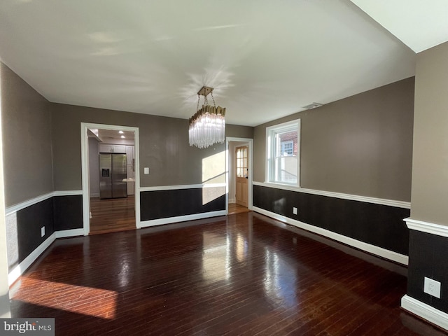 4102 N W St, Wilmington, DE 19802 - unfurnished room featuring wood-type flooring and a chandelier