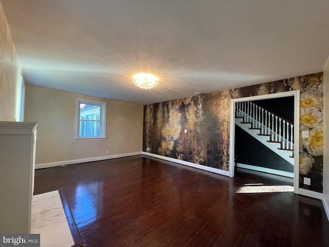 4102 N W St, Wilmington, DE 19802 - unfurnished living room featuring stairs, hardwood / wood-style floors, and an accent wall