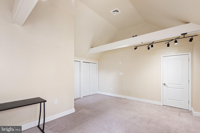 4102 N W St, Wilmington, DE 19802 - carpeted spare room with vaulted ceiling and track lighting