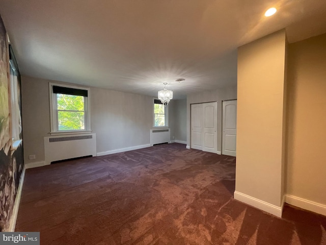 4102 N W St, Wilmington, DE 19802 - spare room featuring radiator heating unit, a chandelier, and plenty of natural light