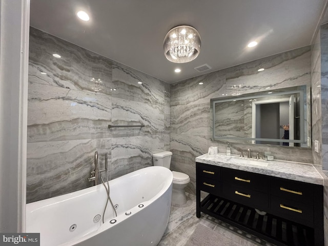 4102 N W St, Wilmington, DE 19802 - bathroom featuring a jetted tub, tile walls, vanity, and marble tiled flooring